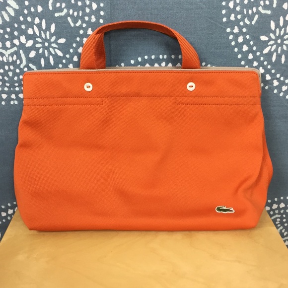 Lacoste Handbags - NWOT Lacoste Orange Canvas Bag w/ Handles